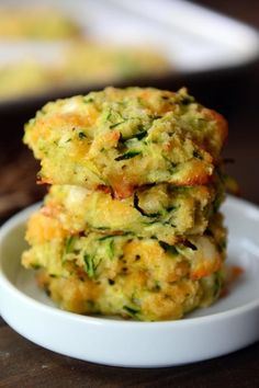 broccoli and zucchini fritters stacked on top of each other