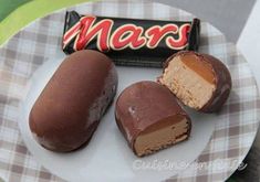 three pieces of chocolate candy on a plate