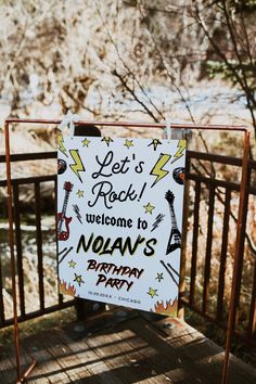 a sign that says let's rock welcome to noah's birthday party