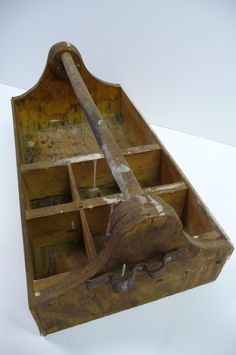 an old wooden tool box with tools in it