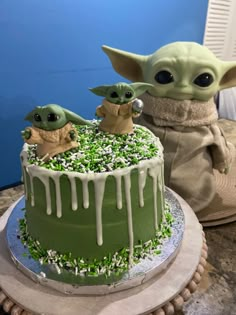 the baby yoda cake is decorated with green icing and sprinkles