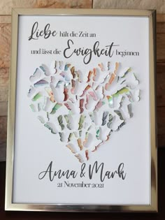 a wedding guest book with the words love and hearts cut out of paper on it