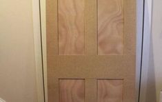 the door is made out of plywood and has two panels on each side,