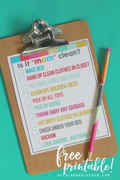 a clipboard with a list on it and a pen next to it that says it's mom clean