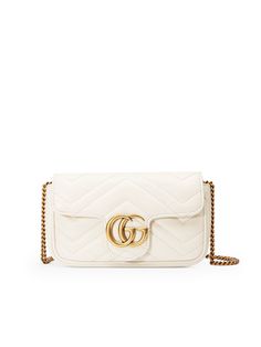 *  GG Marmont
   
 *  Colour: White
   
 *  100% Calfskin leather
   
 *  Gold-toned chain shoulder strap
   
 *  Key ring that can be used to attach this bag to a separate larger bag 
   
 *  Matelassé chevron with a heart
   
 *   Antique gold-toned hardware 
   
 *  Double G 
   
 *  Internal open pocket 
   
 *   Flap with spring closure 
   
 *  Silk lining 
   
 *  Includes dust bag & Care card
   
 * Style ID: 476433 DTDCT 9022
   
 *  Made in Italy  
   



Measurements 

 *  Width: 16,5cm x Height: 9,5cm x Depth: 4,5cm
   
 *  Shoulder strap: 60cm
   

 

 
Gucci GG Marmont Super Mini Matelassé White Leather Shoulder Bag Women's Handbag
in White Calf Skin
GG Marmont Super Mini Matelassé White Leather Shoulder Bag, Handbag, White, Calf
Skin, Leather, Mini, Female. Gg Marmont Mini Bag, Marmont Super Mini, Gucci Gg Marmont Mini, Gg Marmont Mini, Gucci Gg Marmont, Gg Marmont, Mini Shoulder Bag, Large Bag, Chain Shoulder Bag