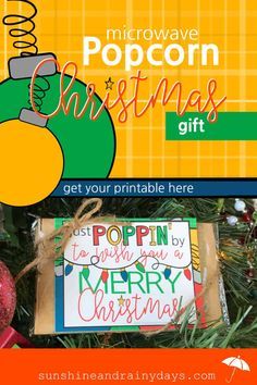 an ornament hanging from a christmas tree with the text microwave popcorn christmas gift get your printable here