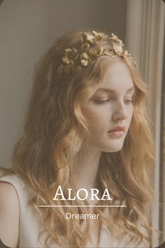 a woman with long blonde hair wearing a gold headpiece and the words alora on it