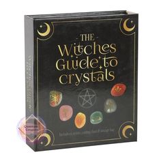 the witches guide to crystalas book with its contents in black and gold lettering on it