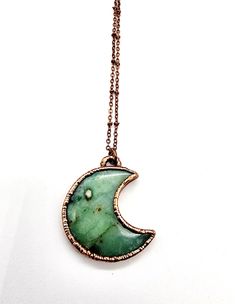 "Previews and updates, visit us on Instagram - @mergingmetals Chrysoprase Crescent Moon Necklace Called the stone of Venus, is the rarest and most valuable rich apple-green gemstone in the chalcedony family and was often mistaken for emeralds by ancient jewelers. Chrysoprase is one of the birthstones for May and has traditionally symbolized happiness, enterprise and prudence. It is a powerful stone that brings good fortune and prosperity.  Pendant measures approximately 1.75\" in height x 1.50\" wide, and comes on a beautiful 20\" soldered copper chain. The scientific and intricate process used to add layers of lovely copper is called electroforming. This process can be unpredictable and can take hours to days to complete just one wearable. There may be small perfect imperfections in the c Green Hand-forged Round Jewelry, Handmade Green Crescent Jewelry, Celestial Green Jewelry With Moon Charm, Green Moon Charm Round Necklace, Green Necklace With Moon Charm, Green Moon Charm Necklace, Green Crescent Moon Charm Jewelry, Bohemian Copper Necklace With Moon Charm, Spiritual Electroformed Round Pendant Necklace