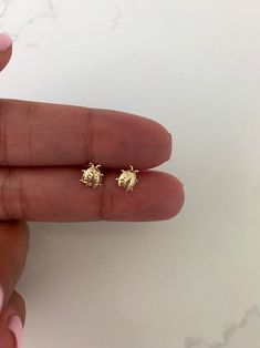 "14K Bezel Ladybug Earrings, Dainty Earrings, Women Earrings, Kid Earrings, Solid Gold Ladybugs, Gold Ladybugs, Gold Earrings ♦ Materials: 14kt Solid Gold, Stone: Cubic Zirconia ♦ Available colors: Clear Cubic Zirconia on Yellow Gold ♦ Closure: Screw Backs ♦ Earrings Measurements: 7x6 (LxW) Millimeters -------------------------------------------------- ♦ -------------------------------------------------- PRODUCTION TIMES Order processing time varies between 1-2 business days, we work on our piec Kid Earrings, Ladybug Earrings, Sensitive Ears Earrings, Succulent Jewelry, Japanese Lunch, Cat Earrings Studs, Gold Bar Earrings, Black Stud Earrings, Emerald Earrings Studs