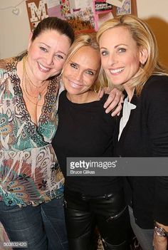 three women are posing for the camera together