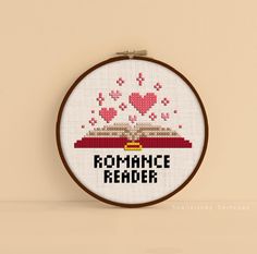 a cross stitch pattern with the words romance reader