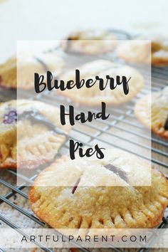 blueberry hand pies cooling on a rack with the words, blueberry hand pies