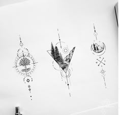 some drawings on a white paper with black and white ink in the middle one has an upside down design