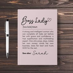 a notepad with the words boss lady on it and a pen next to it