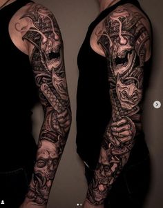 two men with tattoos on their arms, one has a dragon and the other is a skull