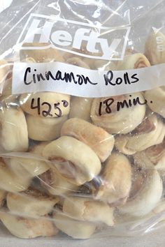 there is a bag of cinnamon rolls wrapped in plastic and labeled with the words helly