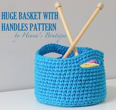 two knitting needles in a blue basket with text overlay that reads, huge basket with handles pattern by hannah's boutique