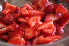 sliced strawberries in a glass bowl ready to be eaten