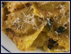 pasta with parmesan cheese and spinach on a plate