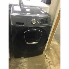 a washer and dryer sitting next to each other