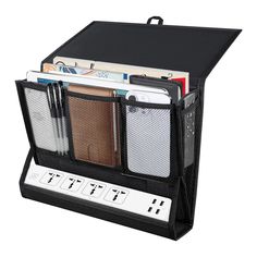 a black organizer with multiple compartments for magazines and folders