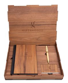 a wooden box with a pen and notebook inside