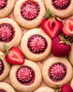 strawberry shortbread cookies with jelly filling and fresh strawberries on the side, top view