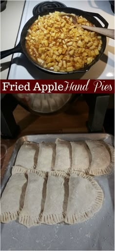 fried apple hand pies in a cast iron skillet on top of a stove