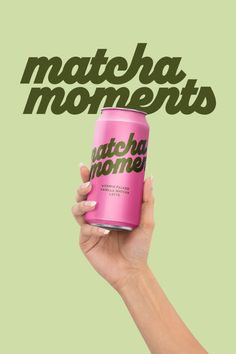 a hand holding a pink can with the words matcha moments in green and black