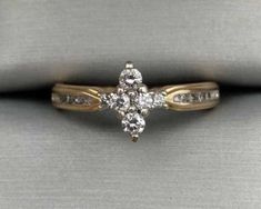 an engagement ring with three diamonds on it