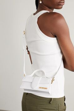 Find JACQUEMUS Le Bambino Leather Tote on Editorialist. Jacquemus' shows always feature a curation of the French designer's much-adored bags. This 'Le Bambino' design is made from hand-selected leather and has a single card slot at the back. Why not match any jewelry to the polished gold-tone logo plaque? Designer Leather Bags, Jacquemus Bag, Orange Bag, Brown Bags, Metallic Logo, Leather Top, Leather Mini, Leather Design, White Bag