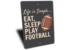 a sign that says life is simple eat sleep play football on the front of it