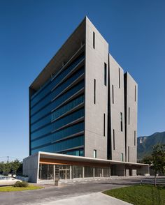 an office building in the middle of a parking lot