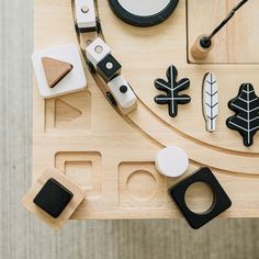 a wooden table topped with lots of different types of items on top of each other