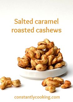 salted caramel roasted cashews in a white bowl on a white background