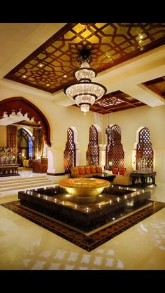 an elaborately decorated living room with chandelier