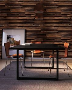 a modern dining table and chairs in front of a wooden wall