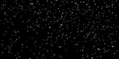 black and white photo of snow falling down on the ground in the dark night sky