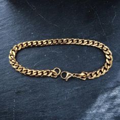 18k gold plated stainless steel curb chain bracelet High Quality 18k Gold plated & water proof ◇ Lengths (inches): 6" (XS)7" (S)8" (M)9" (L)◇Choose between 3mm or 5mm widthSimple staple piece of jewelry perfect for everyday wear !◇ Jewelry comes in a custom Machi Jewelry pouch🎁 gift boxes/wrapping costs an extra £3 which can be added at checkout. Cuban Link Stainless Steel Bracelet With Adjustable Chain, Cuban Link Bracelet With Curb Chain In Metal, Metal Cuban Link Bracelet With Curb Chain, Stainless Steel Cuban Link Bracelet With Adjustable Chain, Stainless Steel Cuban Link Bracelet With Curb Chain, Tarnish Resistant Stainless Steel Chain Link Bracelets, Stainless Steel Tarnish Resistant Chain Link Bracelets, Cuban Link Bracelet In Stainless Steel With Gold Chain, Gold Chain Cuban Link Bracelet In Stainless Steel