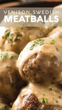 some meatballs covered in gravy and garnished with parsley on top