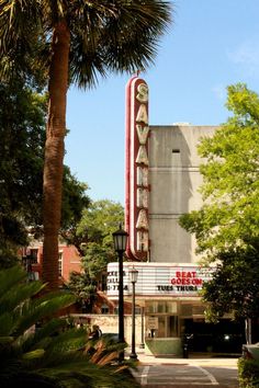 the marquee is located in front of palm trees