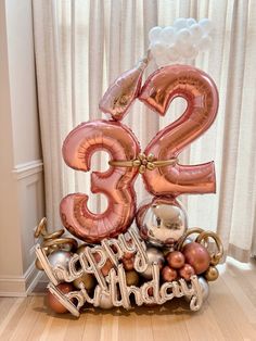 an image of a birthday decoration for someone's 33rd birthday with balloons and decorations