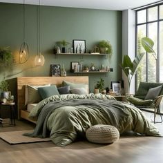 a bedroom with green walls and wooden floors