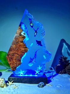 a blue glass sculpture with sea animals on it