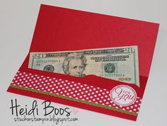 a red envelope with a dollar bill sticking out of it