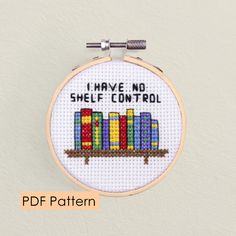 a cross stitch pattern with the words i have no shelf control in front of it