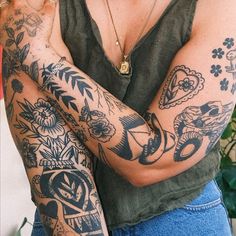 a woman with many tattoos on her arms