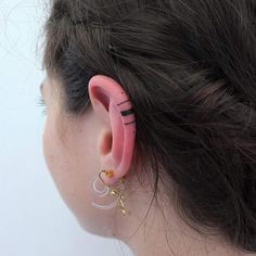 a person with ear piercings on their ears