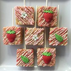 strawberry shortbreads on sticks with icing and strawberries